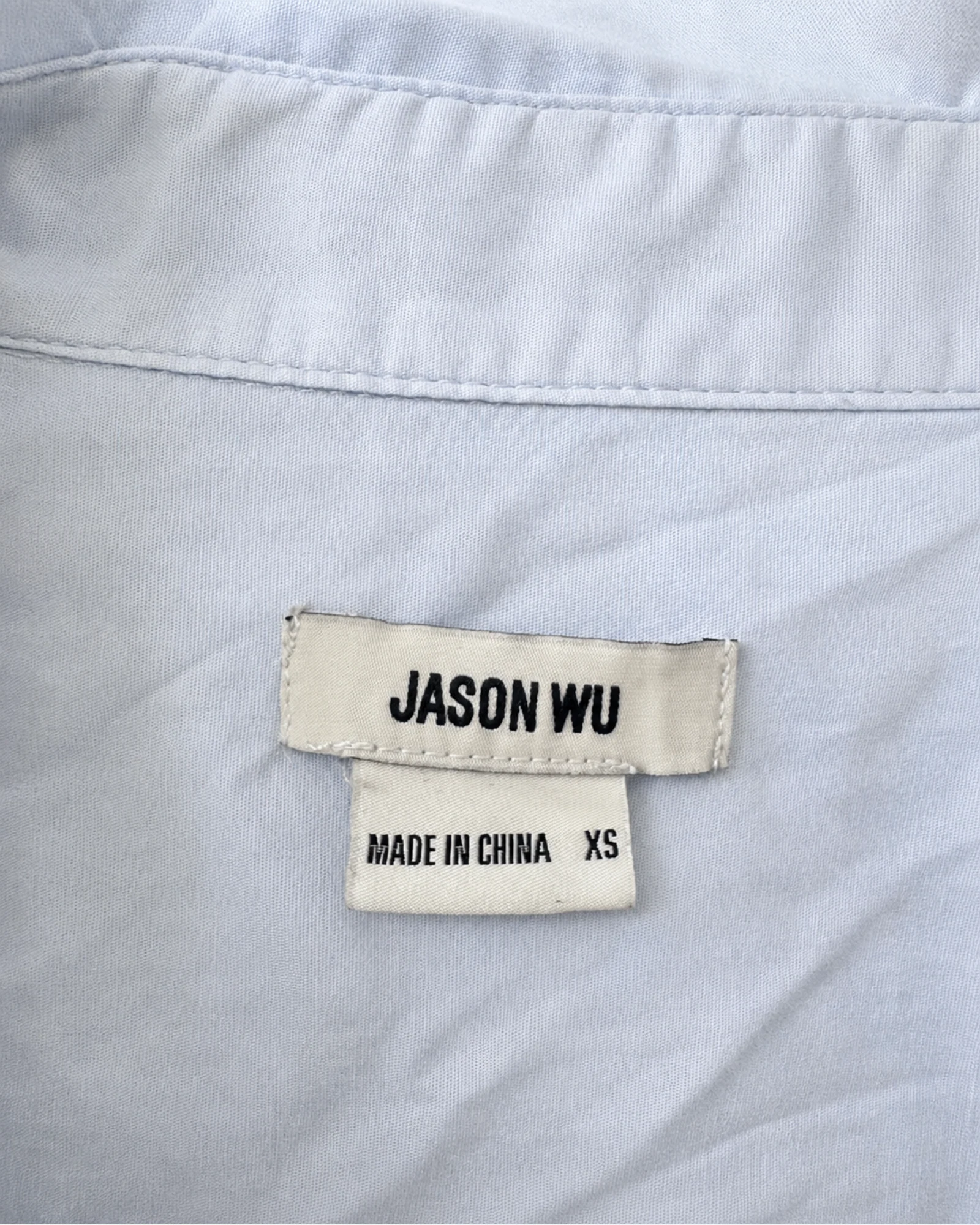 Etiqueta original de marca y talla de camisa o top jason wu light blue y blanco talla xs