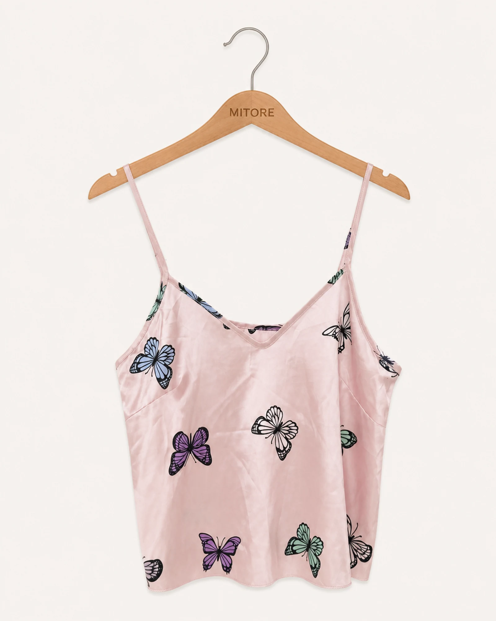 Vista frontal de top rosado y negro talla por confirmar
