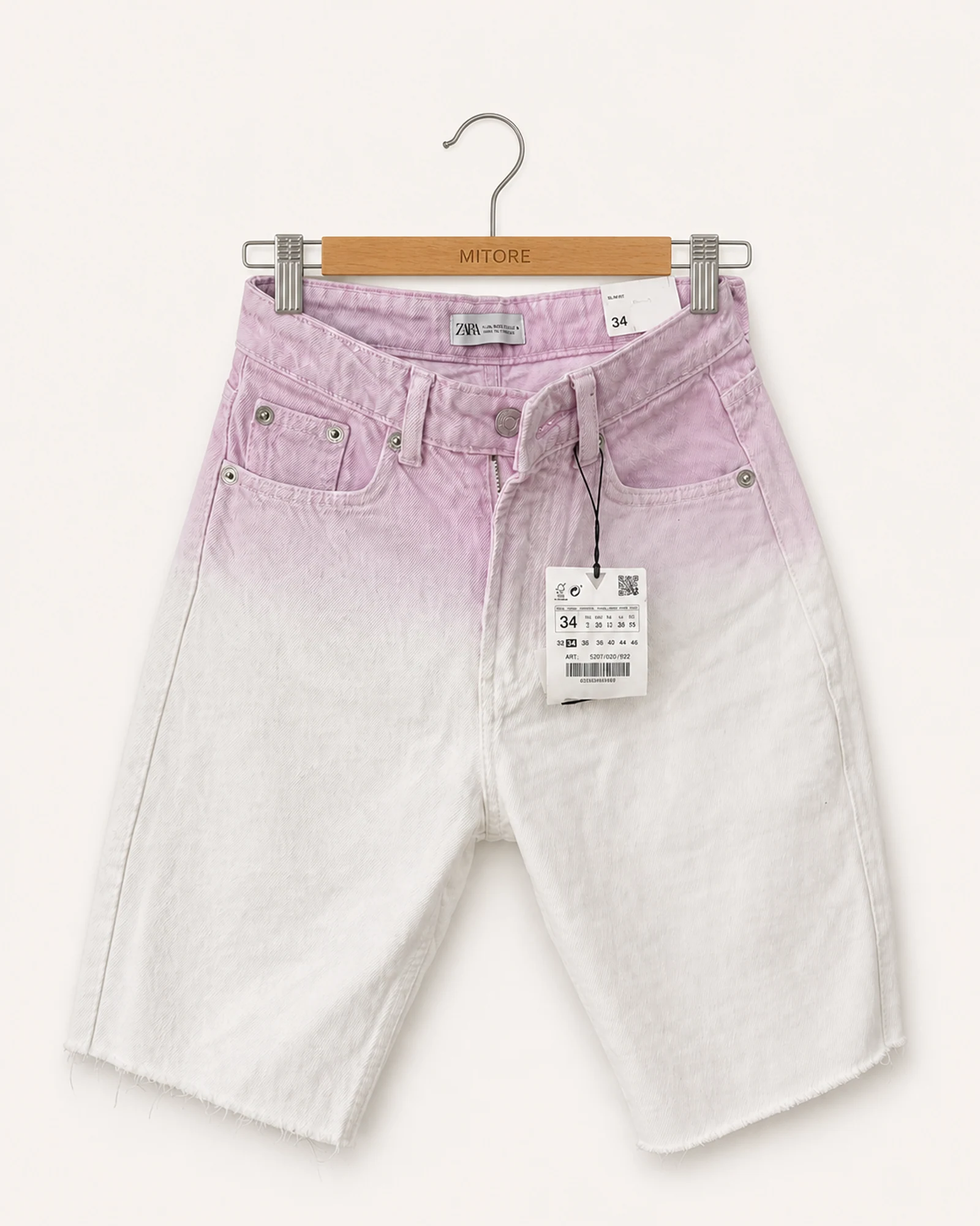 Vista frontal de short zara rosado y blanco talla 34