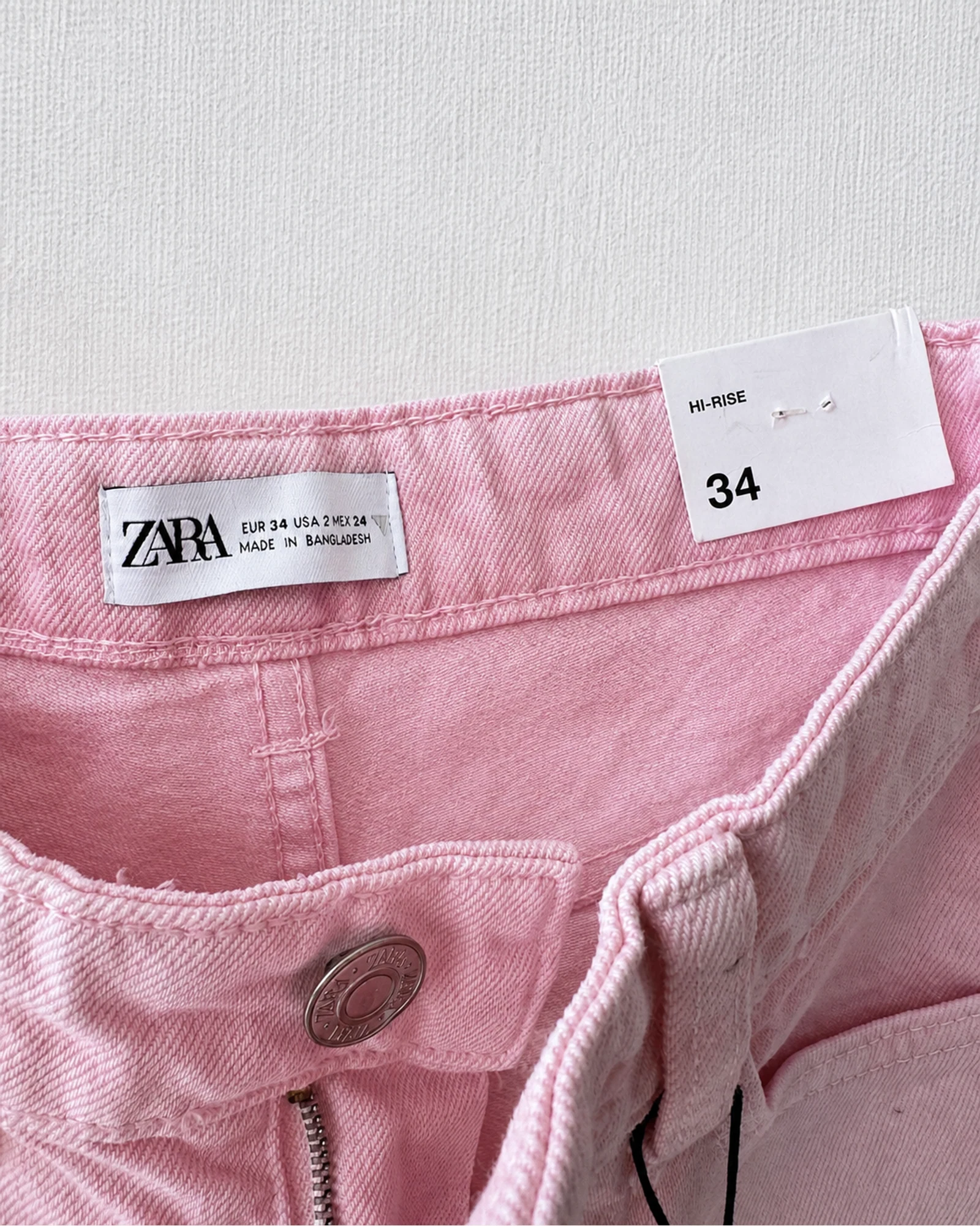 Etiqueta original de marca y talla de short zara rosado y blanco talla 34