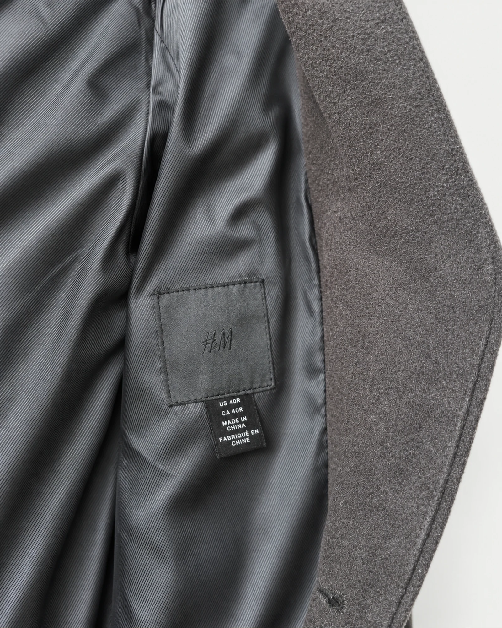 Etiqueta original de marca y talla de chaqueta o blazer h&m gris talla us 40r / ca 40r