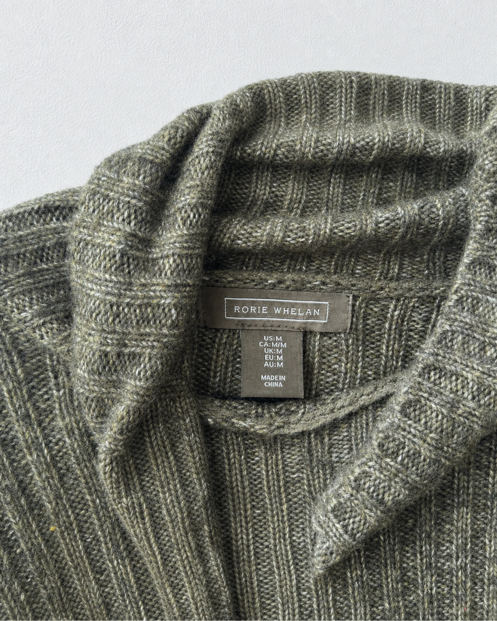 Etiqueta original de marca y talla de suéter o cárdigan romeo & juliet couture gris talla s